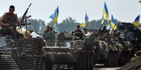 Ukrainian soldiers sit atop armored perso<em></em>nnel carriers near the city of Slaviansk, in eastern Ukraine, on July 11, 2014.