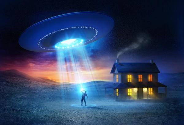 UFO Abduction. A person being abducted in front of his house one spooky evening.