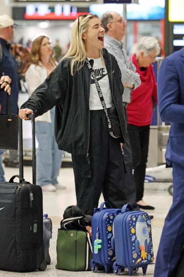Sam Kerr’s girlfriend Kristie Mewis arrives at Brisbane Airport, shortly after the Maltidas team. 